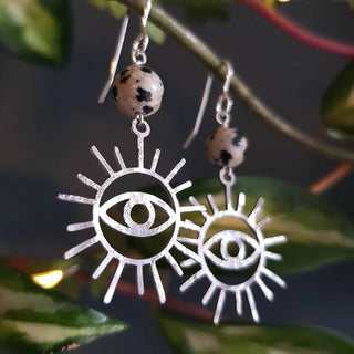 Charity fundraiser design to support the humanitarian crisis in Syria. Shimmering silver earrings with eye of protection design and spotted jasper beads. 'Himaya' ethical hand beaten stainless steel earrings by Nic Danning Jewellery.