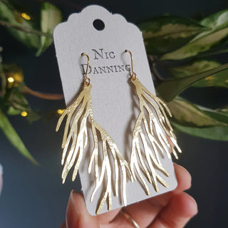 Glowing gold earrings in botanical seaweed design. 'Karenza Dulse' ethical hand beaten brass earrings by Nic Danning Jewellery.