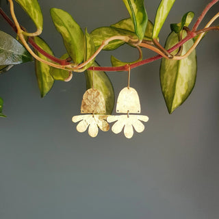 Glowing gold earrings in abstract floral design. 'Tempest Flos' ethical hand beaten brass earrings by Nic Danning Jewellery.