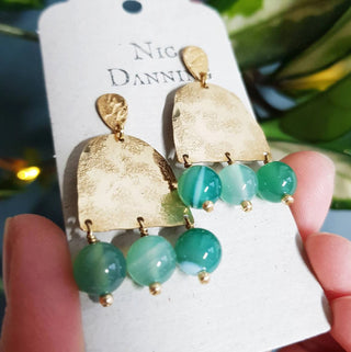 Glowing gold earrings with semi precious agate beadwork. 'Titans Themis' ethical hand beaten brass earrings by Nic Danning Jewellery.