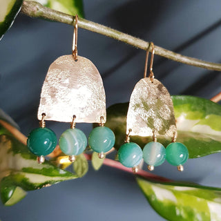 Glowing gold earrings with semi precious agate beadwork. 'Titans Themis' ethical hand beaten brass earrings by Nic Danning Jewellery.