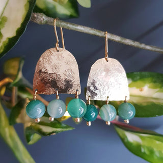Glowing gold earrings with semi precious agate beadwork. 'Titans Themis' ethical hand beaten brass earrings by Nic Danning Jewellery.